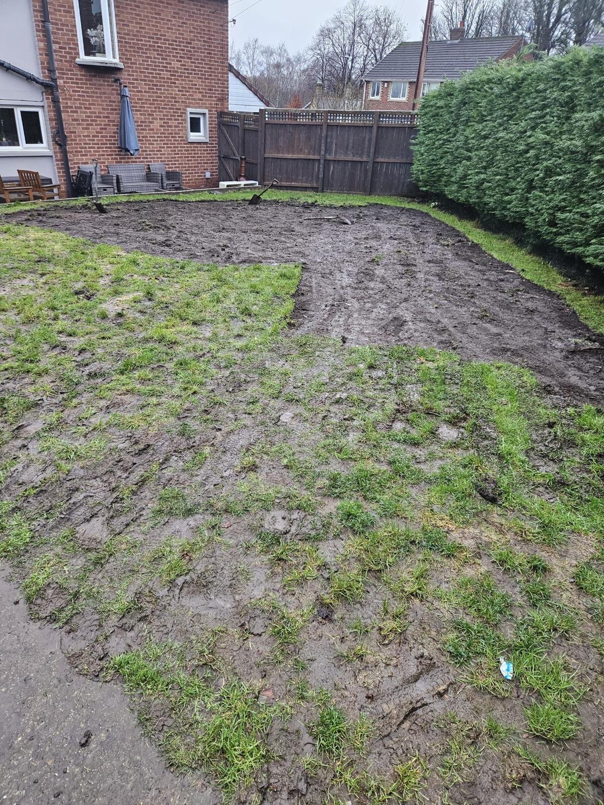 Muddy pet garden before durable turf in Boldon